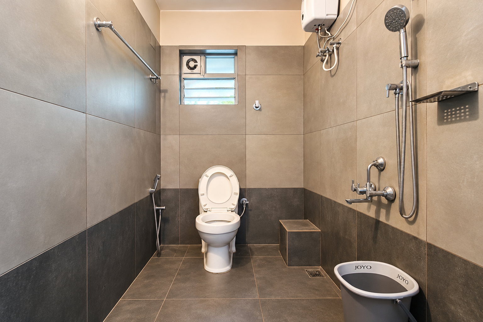 Tiled attached bathroom with shower