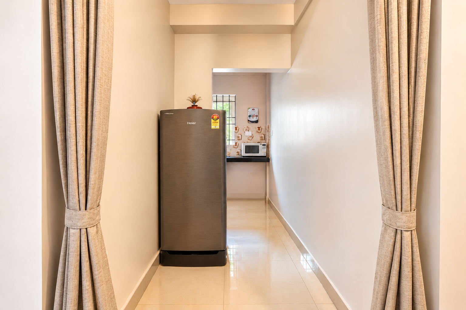 Bright corridor leading to kitchenette